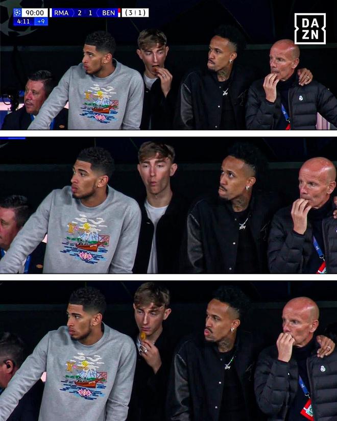 来这儿吃饭来了？赫伊森替补席观赛不停吃食并四处张望